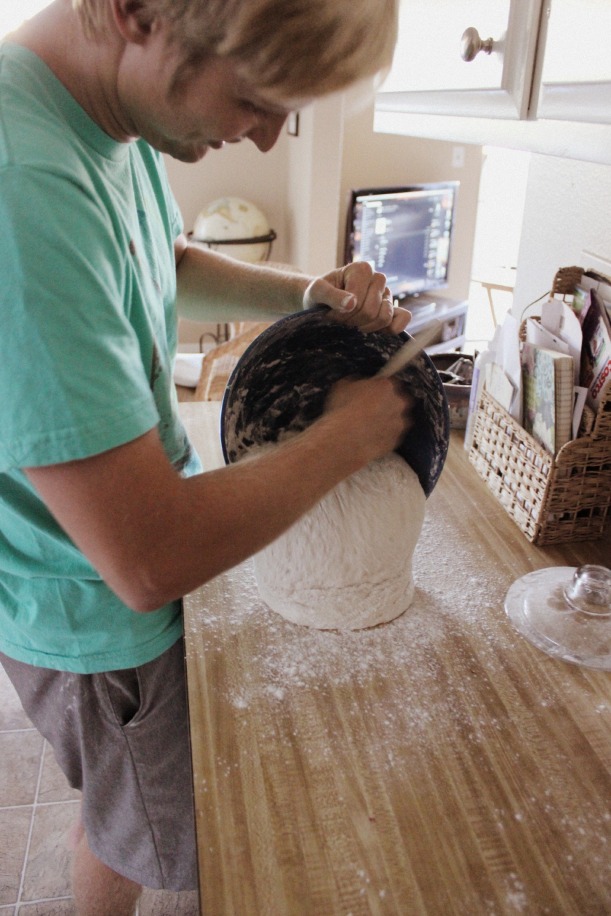 Miles getting the dough out of the bowl onto floured surface