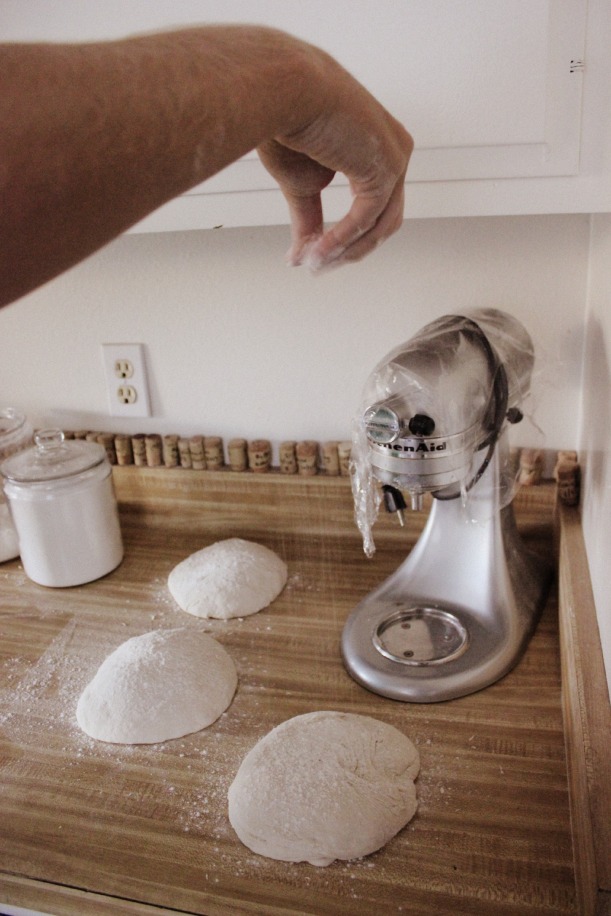 Sprinkle each dough ball with a little flour